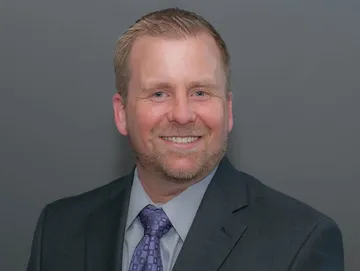 Headshot in formal suit